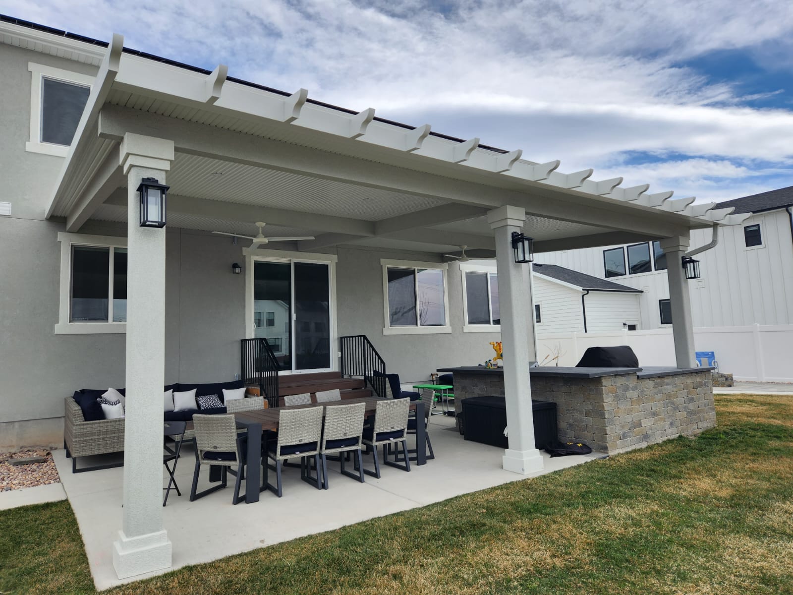 Solid covered patio with aluminum and stone accents