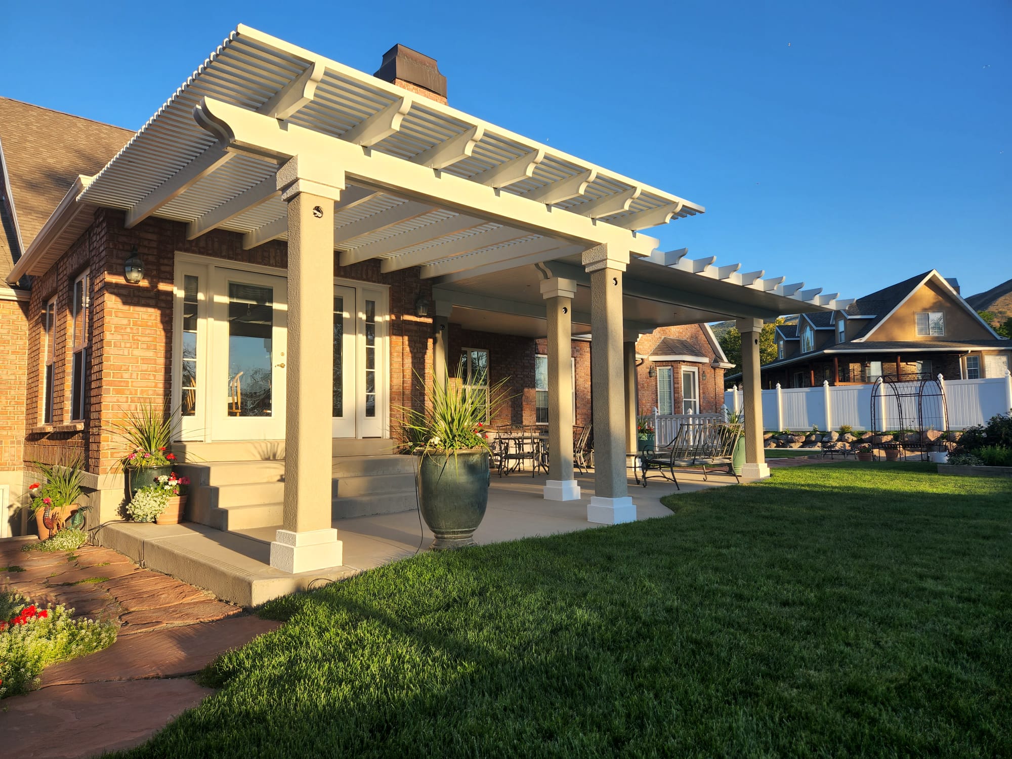 Solid covered patio with aluminum and stone accents